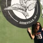 April in front of Twin Leaf Brewery mural Asheville North Carolina copy