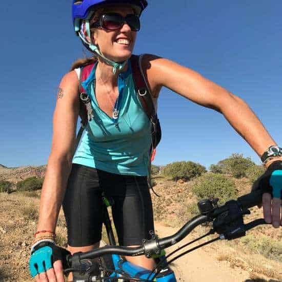 April on her mountain bike in Colorado on a sunny day