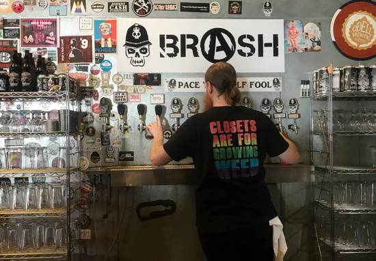 Houston brewery Brash Brewing Company beertender pouring beer