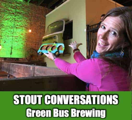 April holding a flight carved to look like the Mystery Machine at Green Bus Brewing in Huntsville, Alabama