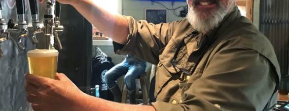 JC from Bandit Brewin Company in Darby Montana pouring a beer