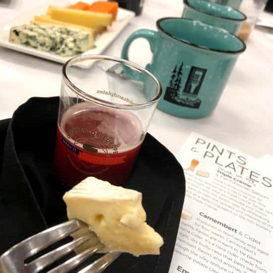 BeerNow Conference 2019 soft white cheese on a fork with beer in the background