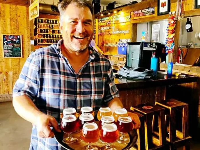 Tim Myers of Strange Craft - tray of beer