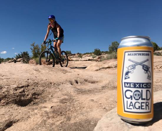 April biking near Moab with a lager in the foreground 