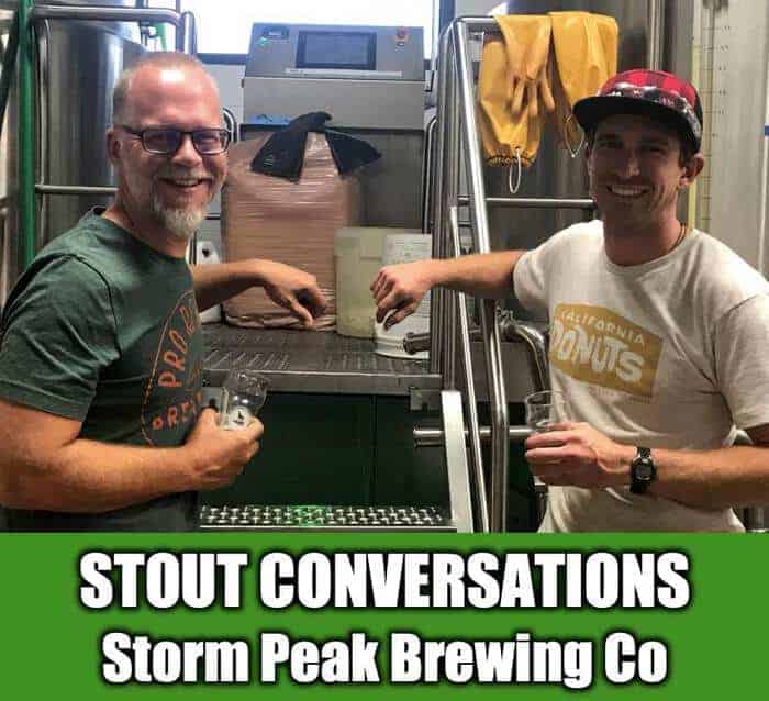 Rob and Ken holding beers in from tof brewing system at Storm Peak Brewing Co in Steamboat Springs Colorado