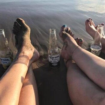Coronas on a beercation - feet in the sand with coronas new to them