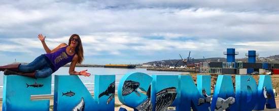 Ensenada Baja Mexico sign and April sitting on it