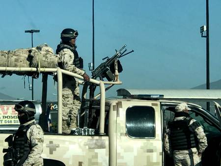 military in a truck while sitting in a Walmart parking lot in Ensenada Baja Mexico