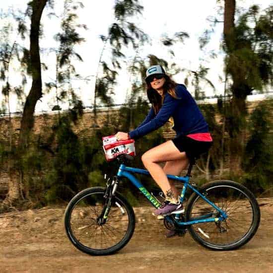 April riding bike with a 12 pack of Tecate preparing for the Battle of the Beer