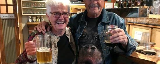 Carol and Dave from Ten Sleep Wyoming holding beers