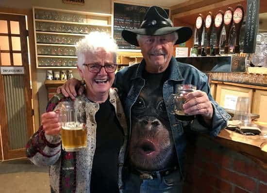 Carol and Dave from Ten Sleep Wyoming holding beers