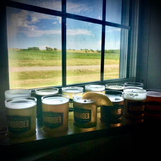 flight of Kinkaider beer at the window of farmland Nebraska
