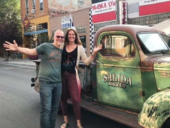 Ken and April posing next to truck in Salida Colorado