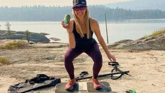 Jill working out on FlexFixx while holding beer on a lakeJill working out on FlexFixx while holding beer on a lake