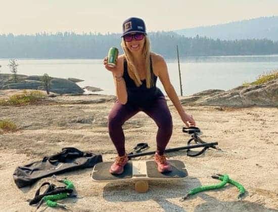 Jill working out on FlexFixx while holding beer on a lakeJill working out on FlexFixx while holding beer on a lake