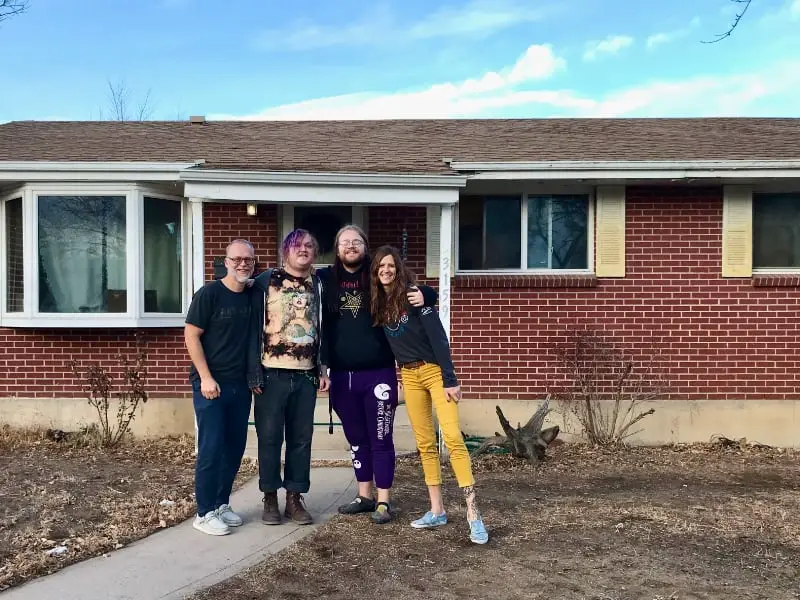 Pishna family in front of home in Denver