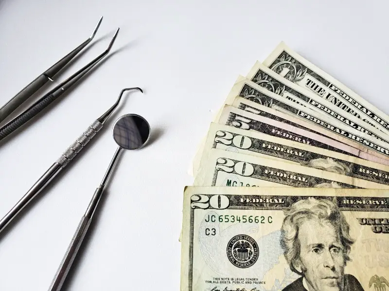 money and dental tools
