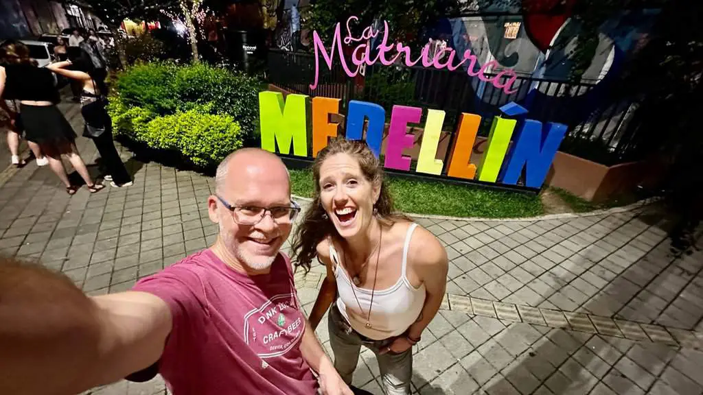 April and Ken in front of Medellin sign