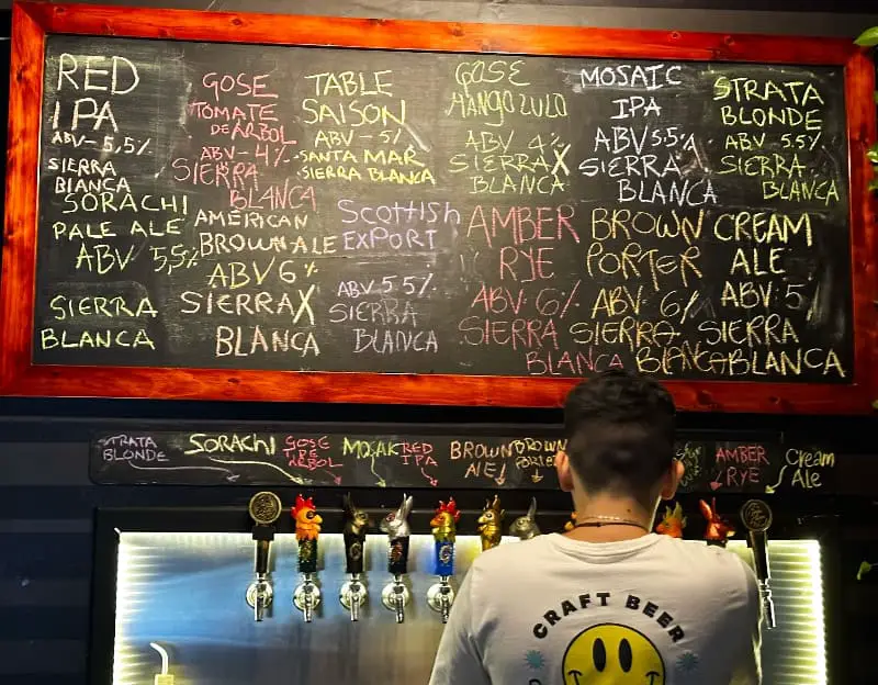 chalkboard tap list and beertender Sierra Blanca Medellin Colombia