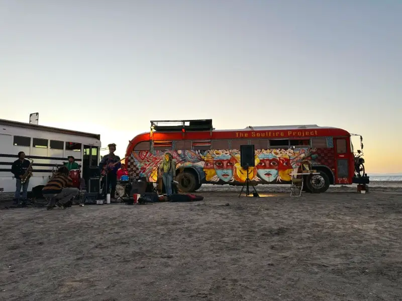 The Soulfire Project bus on the beach in Baja