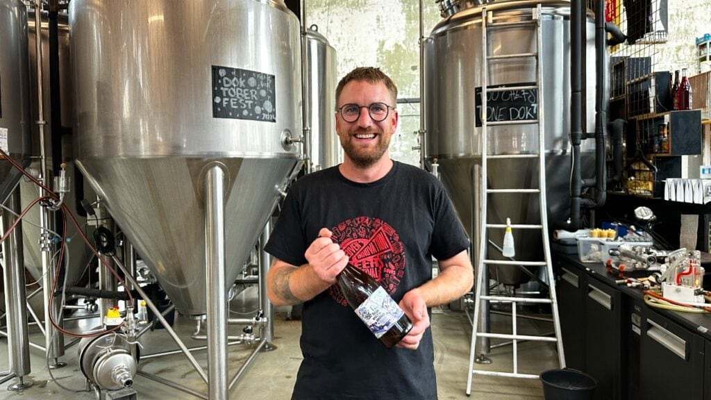 Janos holding beer at Dok Ghent Belgium